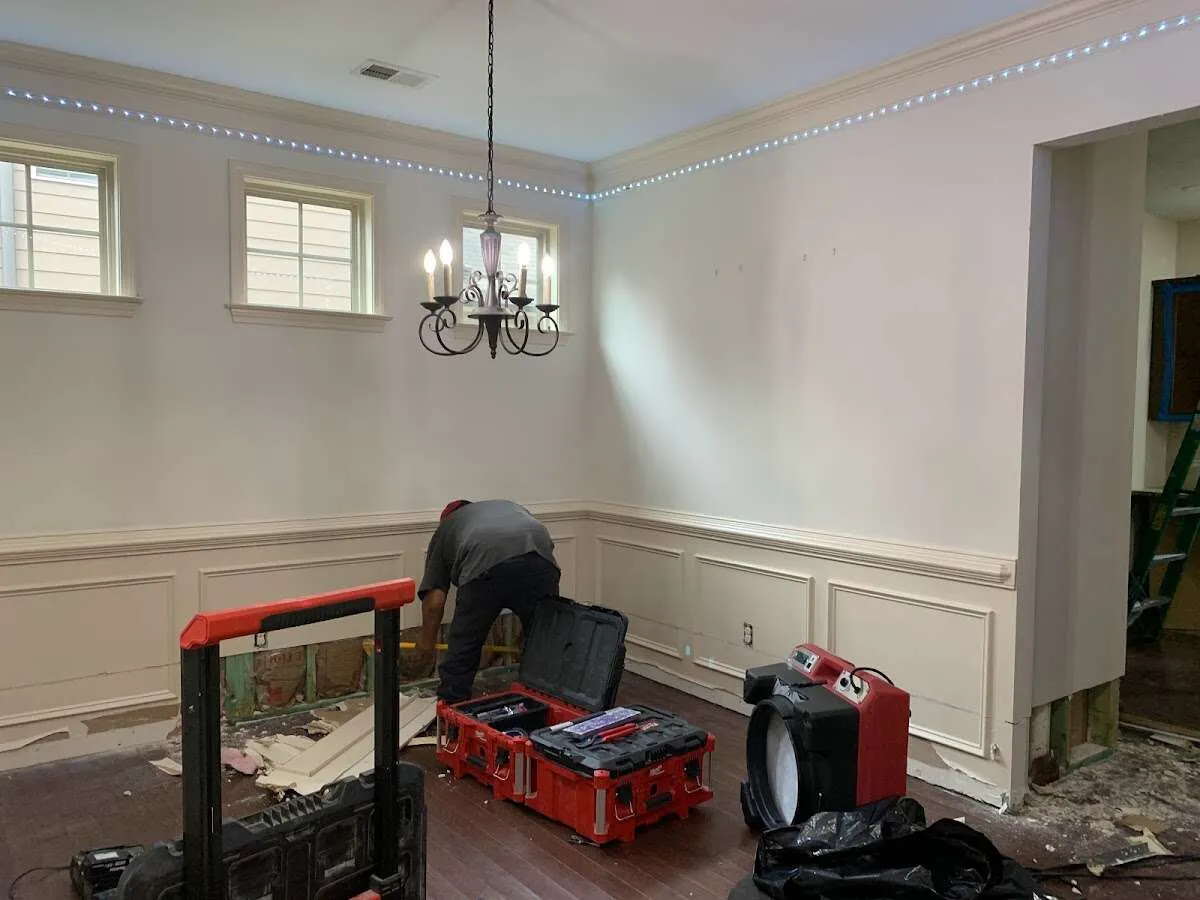 Restoration technician with professional equipment in Oakton